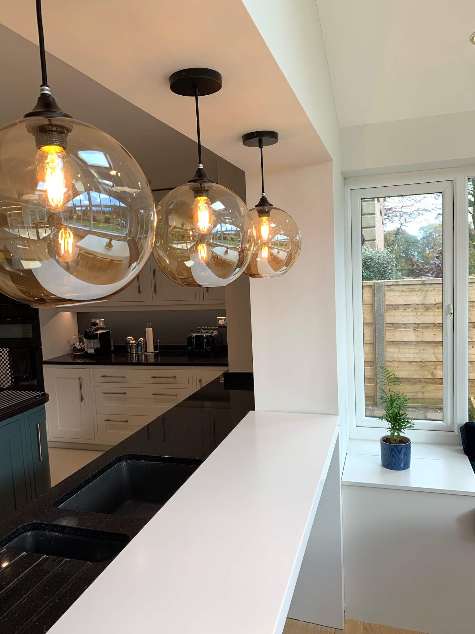 Interesting Ball shaped Light fitting over Kitchen counter in High Leigh