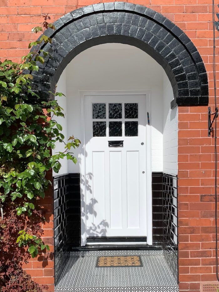 Black and White traditional front door in Hale
