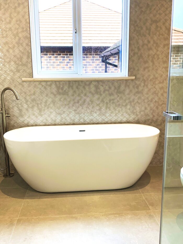 Stunning bathroom design with free standing bath at period semi in Hale