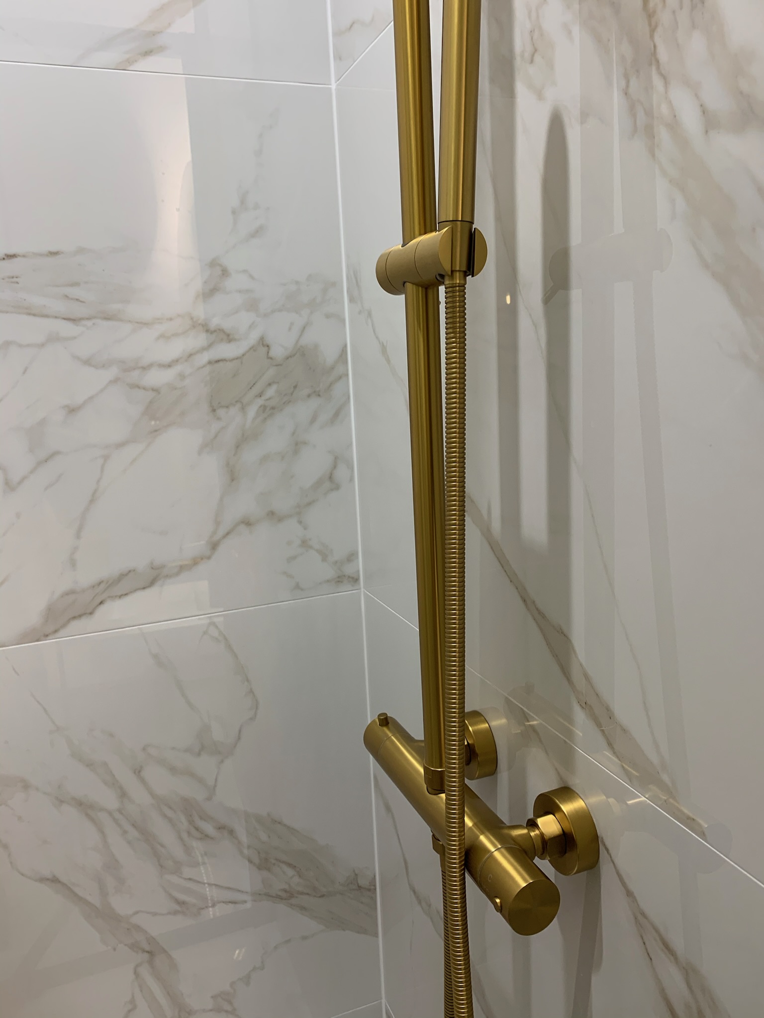 Gold detailing in the bathroom in this eclectic house in Hale