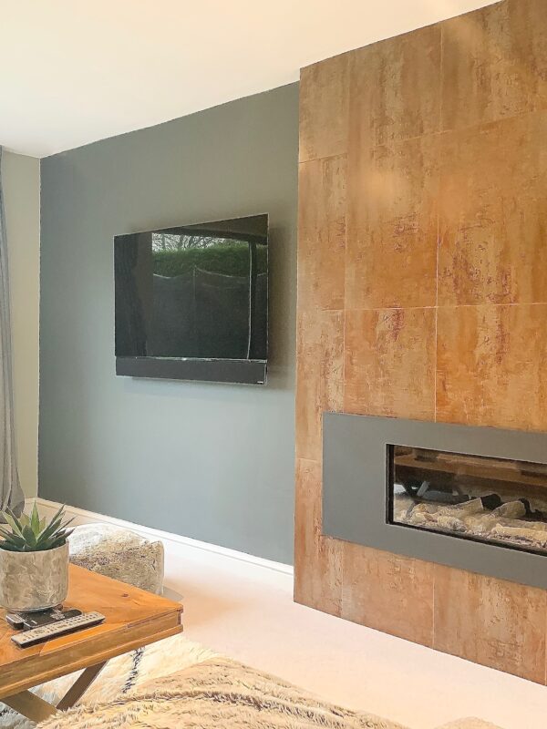 bright comfortable modern fireplace in a contemporary home in Hale Barns