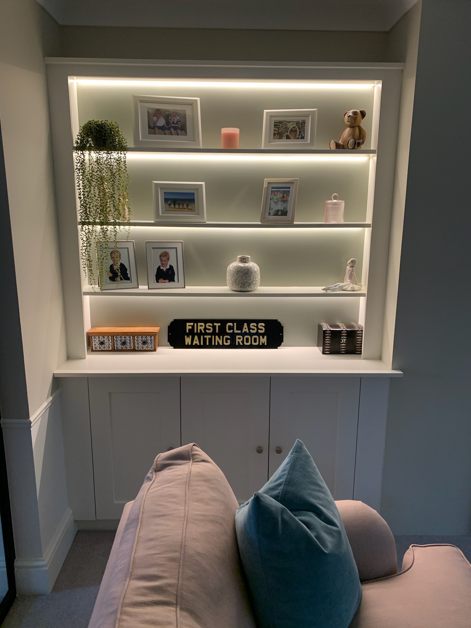 cabinet in lounge with photographs