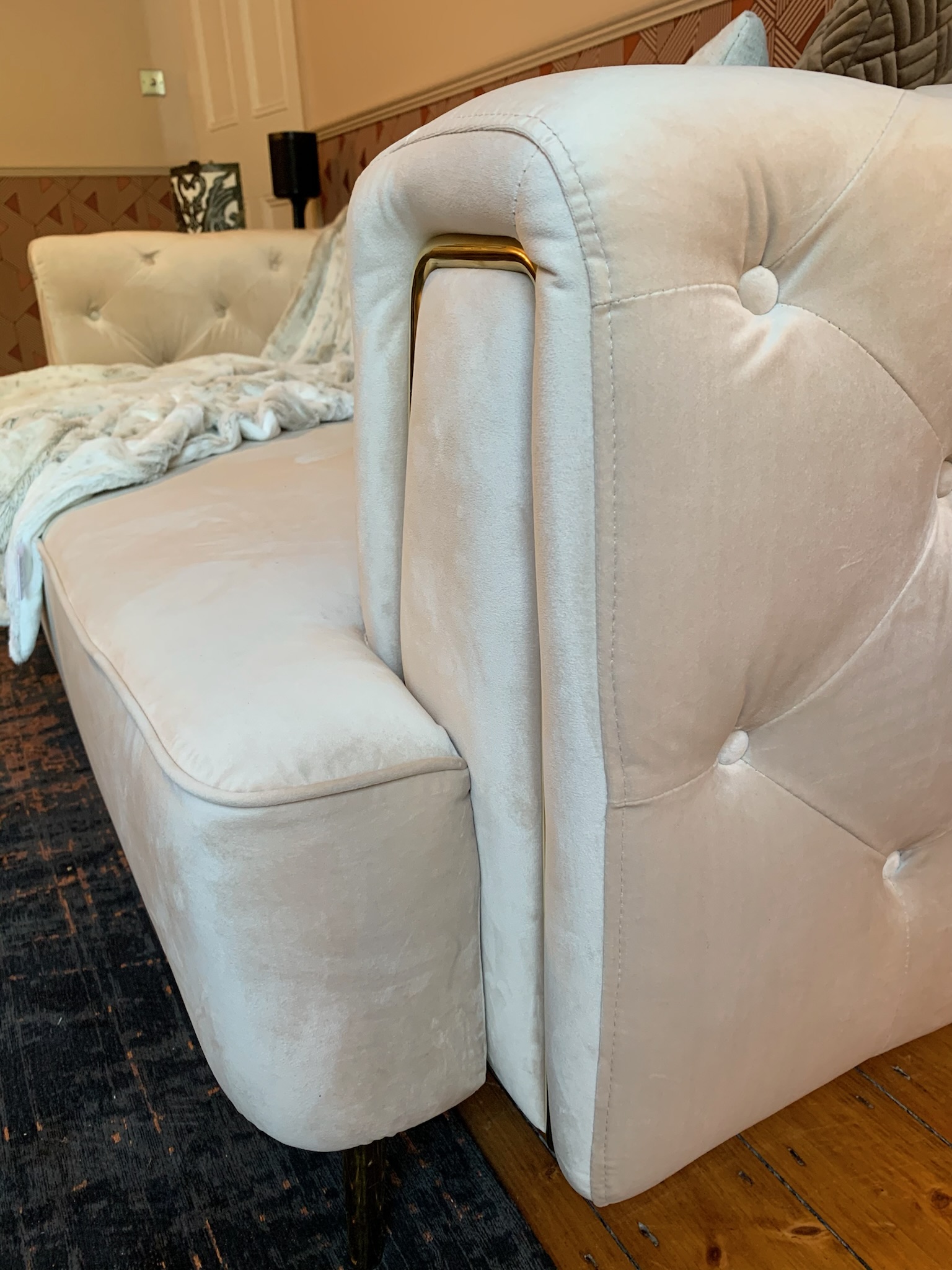 Cream sofa detailing from eclectic home in Hale